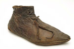 Leather shoe with pointed toe and leather laces: late 14th century